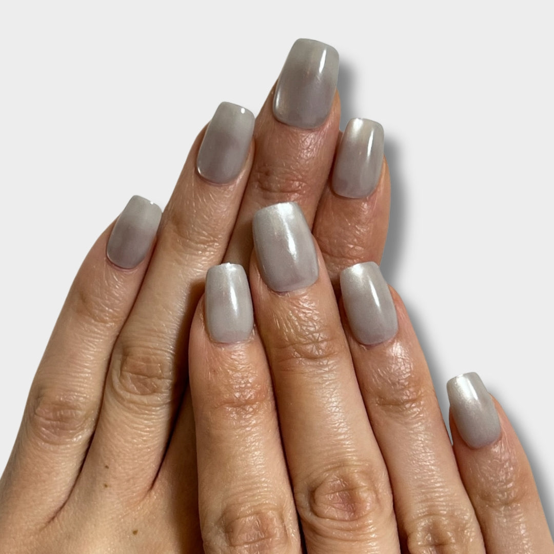 Stone Milk by The Instant Nails in a sleek bottle, showcasing its smooth texture and natural stone-inspired design.