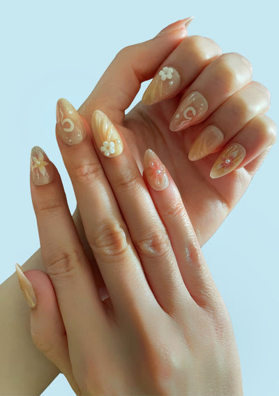 Sea Bloom Press On Nails by Ma boutique featuring a floral design on long, glossy nail tips.